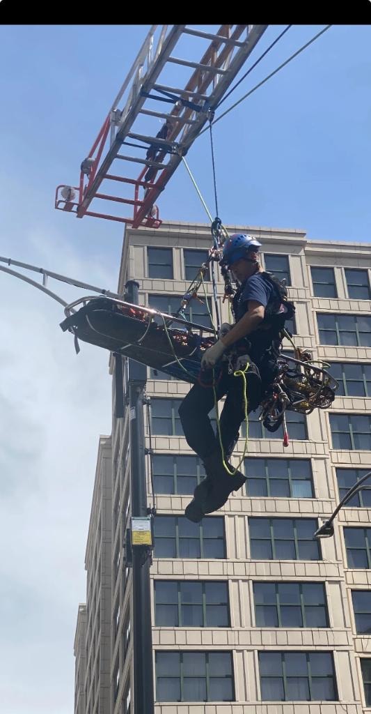 Rescue technician working on a high-angle rope system